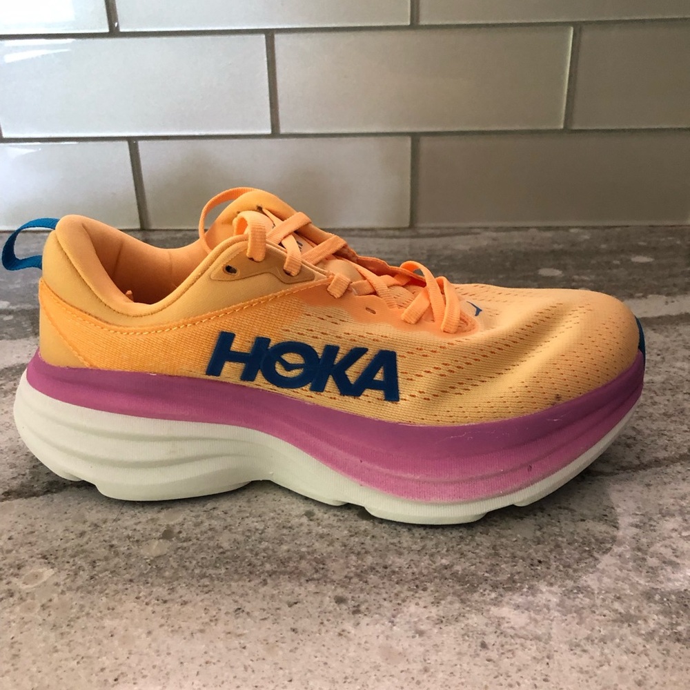 Hoka Vibrant Orange and Pink Athletic Shoes